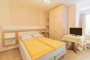Postel nebo postele na pokoji v ubytování Hotel Le Postillon