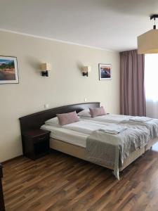 Posteľ alebo postele v izbe v ubytovaní Apartment Olymp