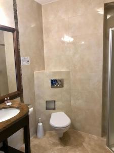 Kúpeľňa v ubytovaní Apartment Olymp