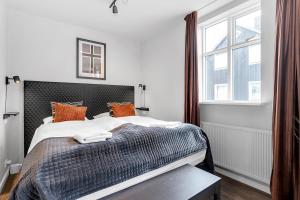 Postel nebo postele na pokoji v ubytování Baldur Apartments