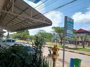 a sign at a gas station with a yellow fire hydrant at Green Garden Guesthouse in Kampot
