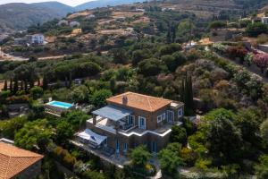 an aerial view of a home in the hills at Luxury villa by the beach in Andros