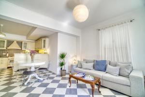 A seating area at Stylish and Cozy Home in Andros Town by Explore Andros