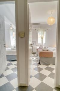 A bed or beds in a room at Stylish and Cozy Home in Andros Town by Explore Andros