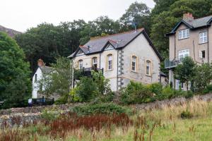 an old house on top of a hill at Converted Chapel, Stunning Sea & Mountain Views! in Penmaen-mawr