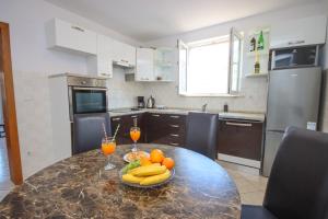 Kuchyň nebo kuchyňský kout v ubytování Apartment Antonio
