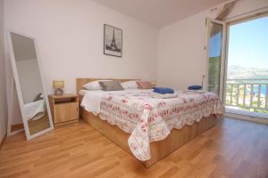 Postel nebo postele na pokoji v ubytování Apartment Antonio