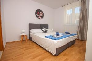 Postel nebo postele na pokoji v ubytování Apartment Antonio