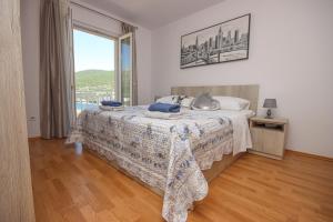 Postel nebo postele na pokoji v ubytování Apartment Antonio