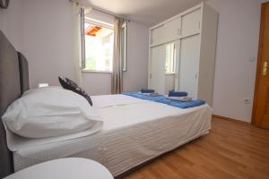 Postel nebo postele na pokoji v ubytování Apartment Antonio