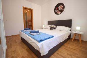 Postel nebo postele na pokoji v ubytování Apartment Antonio
