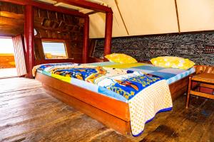 Postel nebo postele na pokoji v ubytování Reggae Guest House