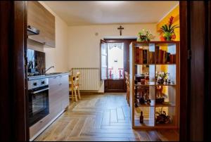 a kitchen with a counter and a cross on the wall at B&B Da Antonella in Troina