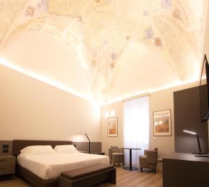 A bed or beds in a room at Hotel Orientale