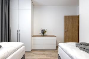 Postel nebo postele na pokoji v ubytování Hubertus Karlova Studánka