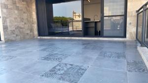 a patio with a tile floor in front of a building at Shui Shang Yuan Homestay in Magong