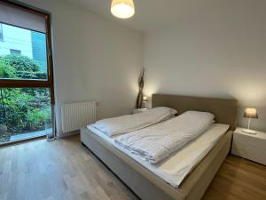 Łóżko lub łóżka w pokoju w obiekcie Home3city Nadmorski Dwór