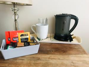 a coffee maker on a tray next to a tea kettle at Single Room - Bed for the night - Close to Beach in St. Leonards