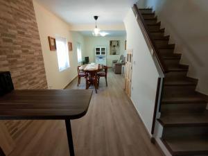 a stairway leading to a dining room and living room at Casa Valentín in Casillas +15 photos