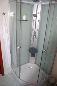a shower with a glass door in a bathroom at Wellness Hotel Marlin in Nová Pec +11 photos