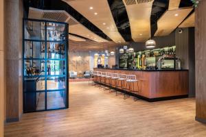 a bar with a bunch of bottles of alcohol at SADU hotel in Almaty