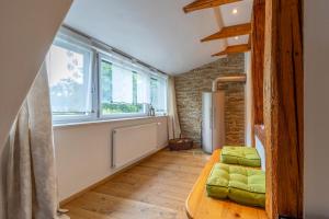 a small room with a bed and a window at das "Ferienhaus Eibiswald" Landhaus Refugium im Schilcherland - Sauna und Spa in Eibiswald +41 photos
