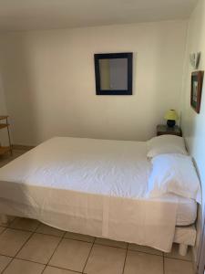 Posteľ alebo postele v izbe v ubytovaní Appartement en rdc à argeles sur mer