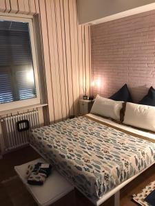 Posteľ alebo postele v izbe v ubytovaní Cinquecento Loft