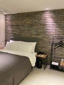 Postel nebo postele na pokoji v ubytování Hotel Gaden