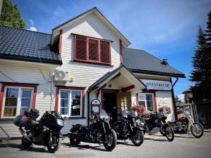 a group of motorcycles parked in front of a house at Aleksandri Guesthouse in Pärnu