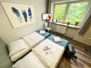 Łóżko lub łóżka w pokoju w obiekcie Willa Sonata - Apartamenty & Balia - Szklarska Poręba