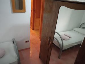 A bed or beds in a room at Rifugio Fulieri in Salento