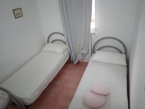 A bed or beds in a room at Rifugio Fulieri in Salento