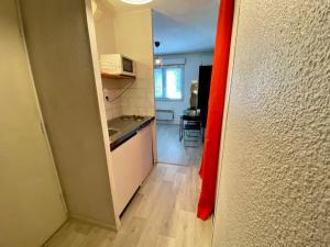 a room with a kitchen with a counter top at Studio le République in Dijon