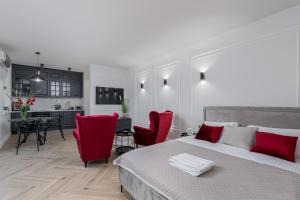 Łóżko lub łóżka w pokoju w obiekcie Apartament w centrum Krakowa 109