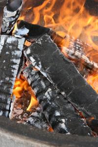 a close up of a fire in a grill at Villa Tumppu in Jämsä