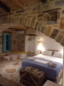 Postel nebo postele na pokoji v ubytování Dimitrakis Guesthouse + 37 fotografií