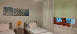 Postel nebo postele na pokoji v ubytování Virginia Apartment