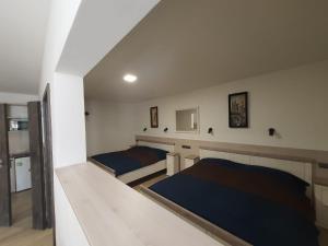Posteľ alebo postele v izbe v ubytovaní Penzion TOŠA