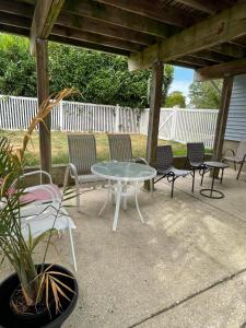 a table and chairs sitting on a patio at Guest Room in Eatontown