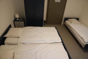 Voodi või voodid majutusasutuse L'auberge de Noiraigue toas