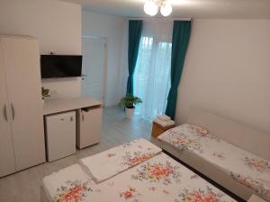 Postel nebo postele na pokoji v ubytování Casa AnaMaria