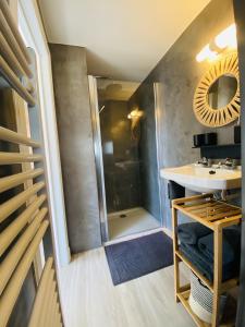 a bathroom with a shower and a sink at Lovely, renovated appartment, near the beach. in De Haan