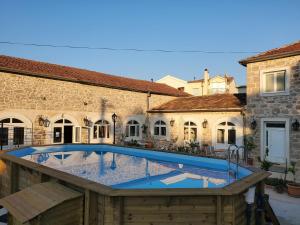 a large swimming pool in the middle of a building at Boutique Vila Marijini Dvori in Tribunj