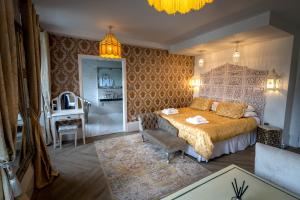 a bedroom with a bed and a table in it at Croydon Hall in Minehead