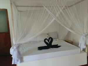 Postel nebo postele na pokoji v ubytování Babalao Rooftop Hotel