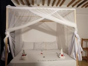 Postel nebo postele na pokoji v ubytování Babalao Rooftop Hotel