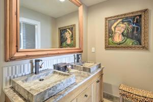 a bathroom with two sinks and a mirror at Rising Fawn Home with Expansive Mountain Views! in Rising Fawn