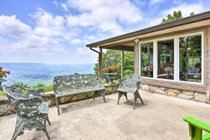 a porch with two chairs and a bench at Rising Fawn Home with Expansive Mountain Views! in Rising Fawn