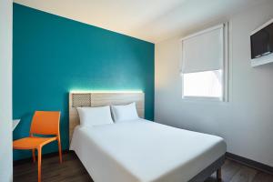Кровать или кровати в номере hotelF1 Metz Actipole